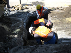 men digging in hole